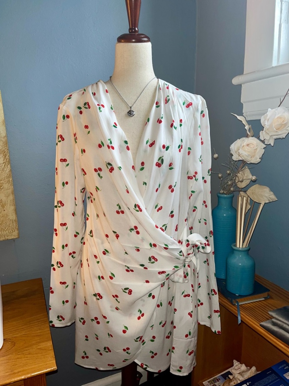 NEW WITH TAGS (retails for $125.00) Size large, “We Wore What”, wrap blouse.